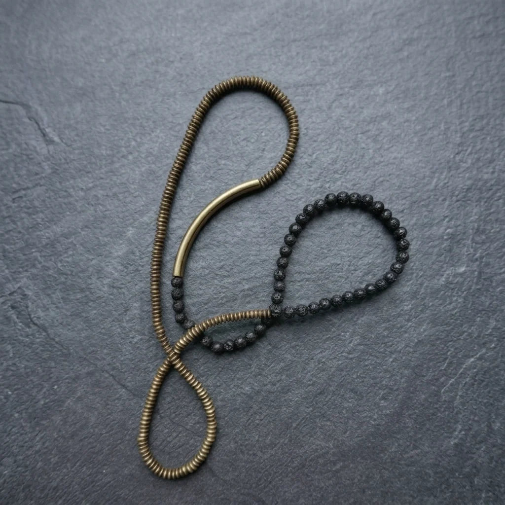Copper and lava bead strand laid out at full length to show the necklace option