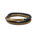 Triple wrap bracelet of copper heishi beads, black lava beads and a curved copper tube bar, white background