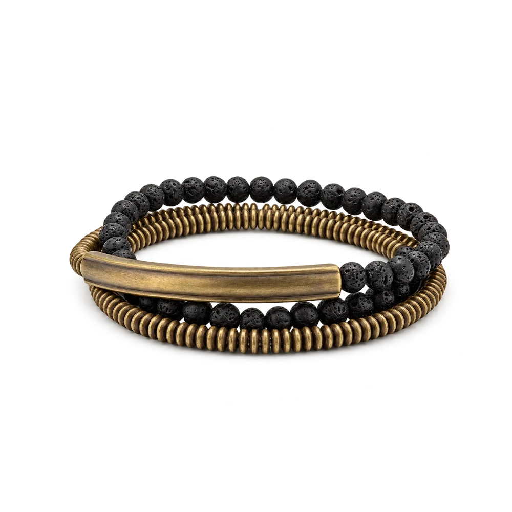 Triple wrap bracelet of copper heishi beads, black lava beads and a curved copper tube bar, white background