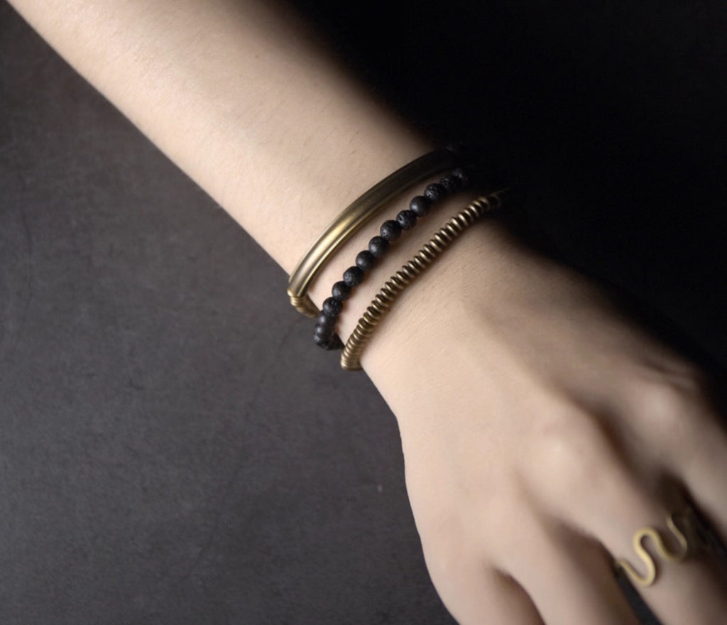 Close-up of the copper and lava bead wrap bracelet on the wrist