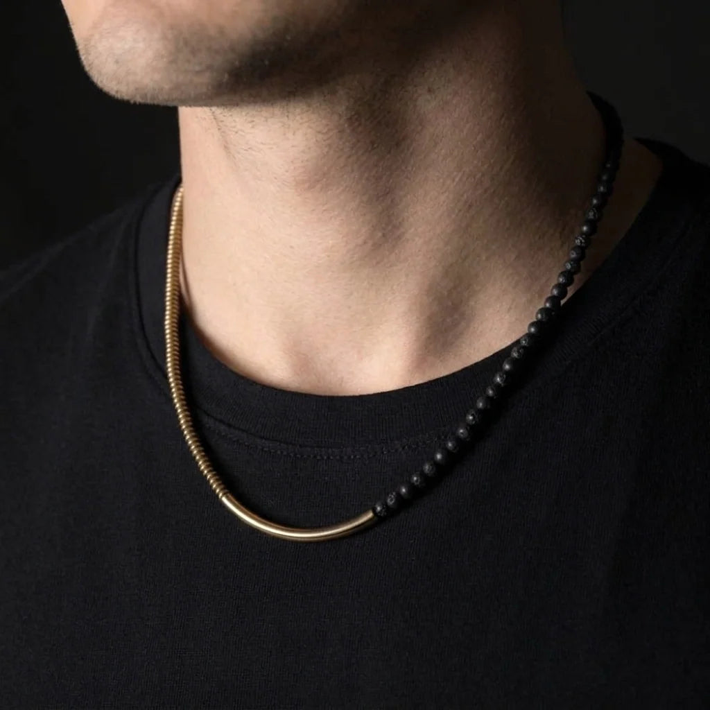 Man wearing the copper and black lava bead necklace with a black t-shirt