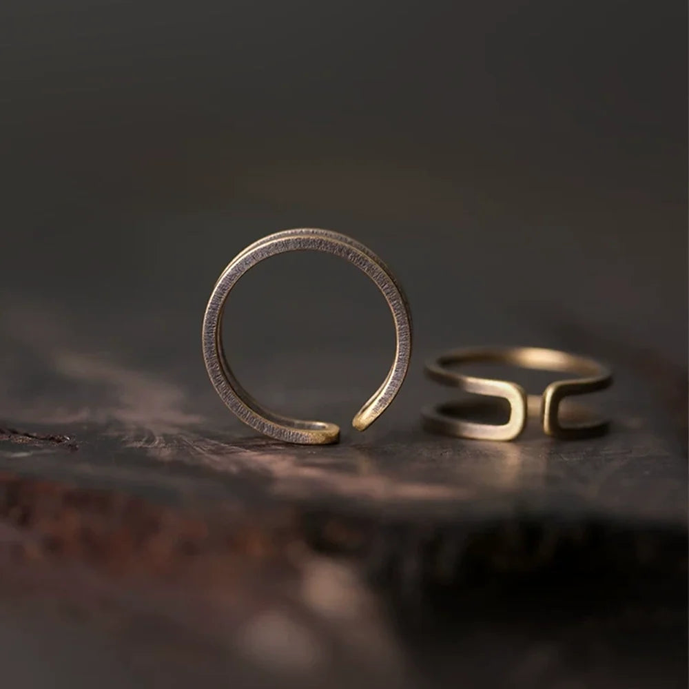 Two views of the double band copper ring showing the open adjustable gap