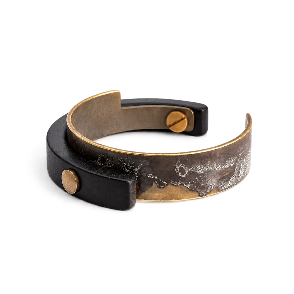 Copper cuff bracelet with verdigris patina and black ebony wood overlay fastened by copper screws, white background