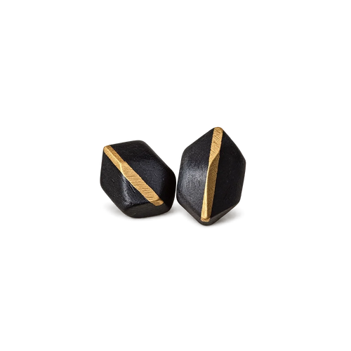 Pair of faceted ebony wood stud earrings with a diagonal copper inlay, white background