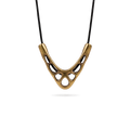 Sculptural V-shaped openwork copper pendant on a black cord necklace, white background