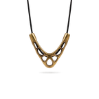 Sculptural V-shaped openwork copper pendant on a black cord necklace, white background