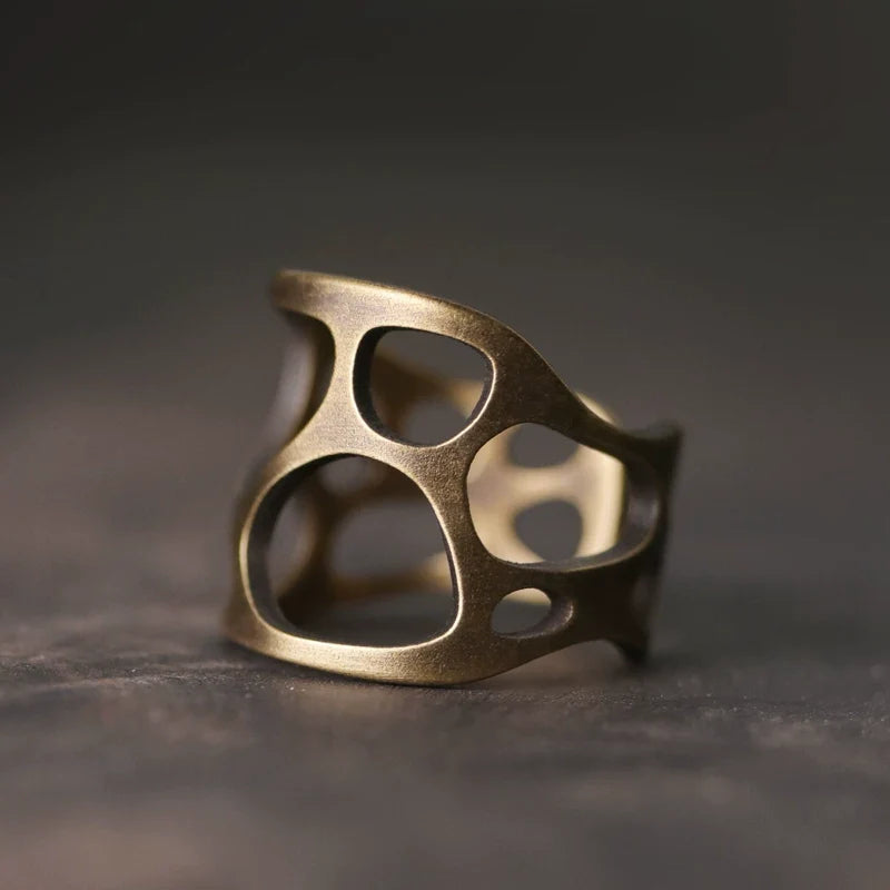 Side view of the wide sculptural copper ring band