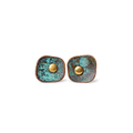 Pair of square verdigris patina copper stud earrings with a domed copper center, white background