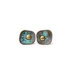 Pair of square verdigris patina copper stud earrings with a domed copper center, white background