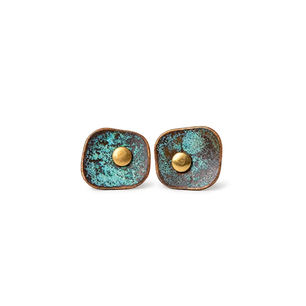 Pair of square verdigris patina copper stud earrings with a domed copper center, white background