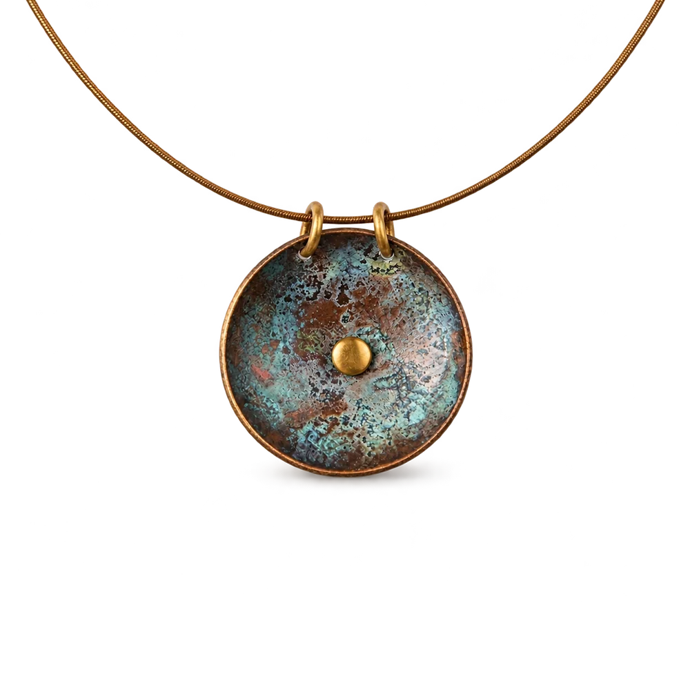 Verdigris patina copper disc pendant on a rigid copper collar necklace, white background
