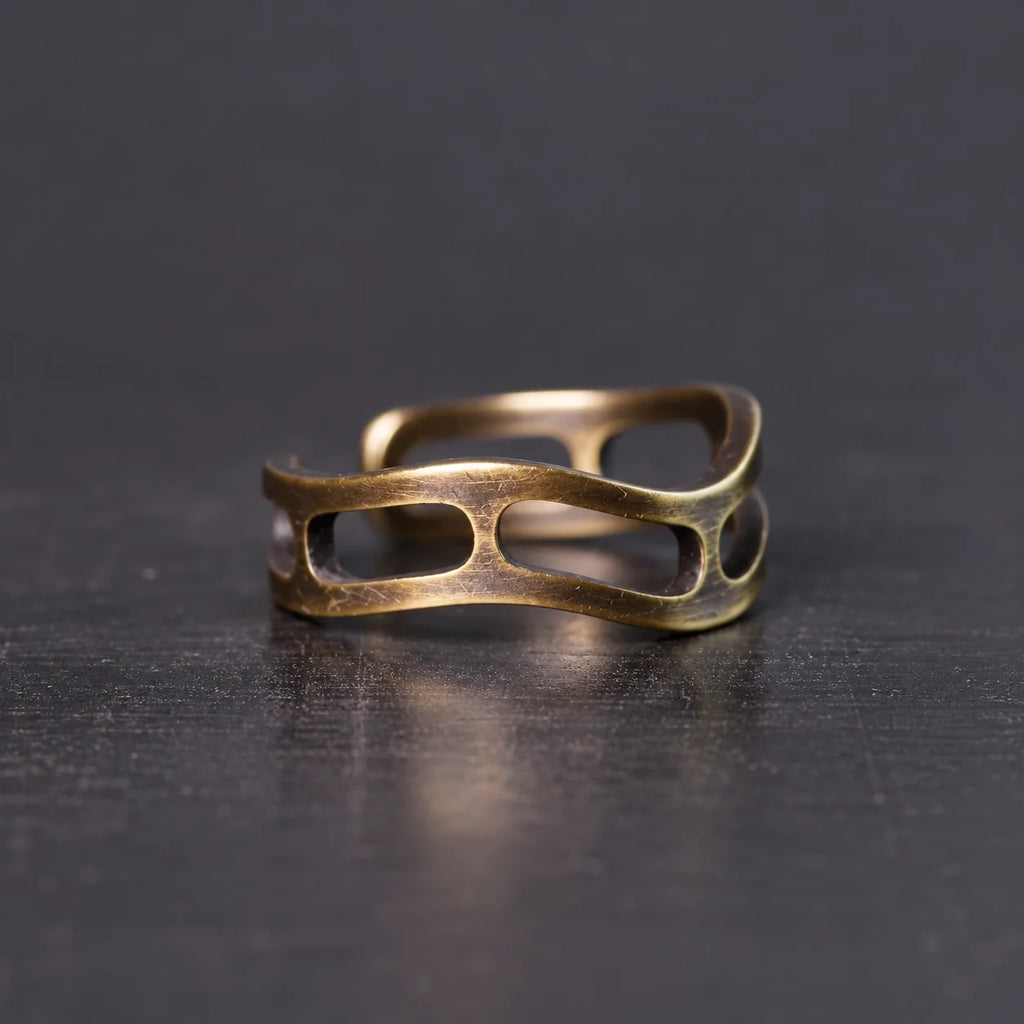 Side view of the wavy copper ring with oval cutouts