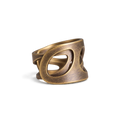 Wide copper ring with crossing oval cutouts and an adjustable open band, white background