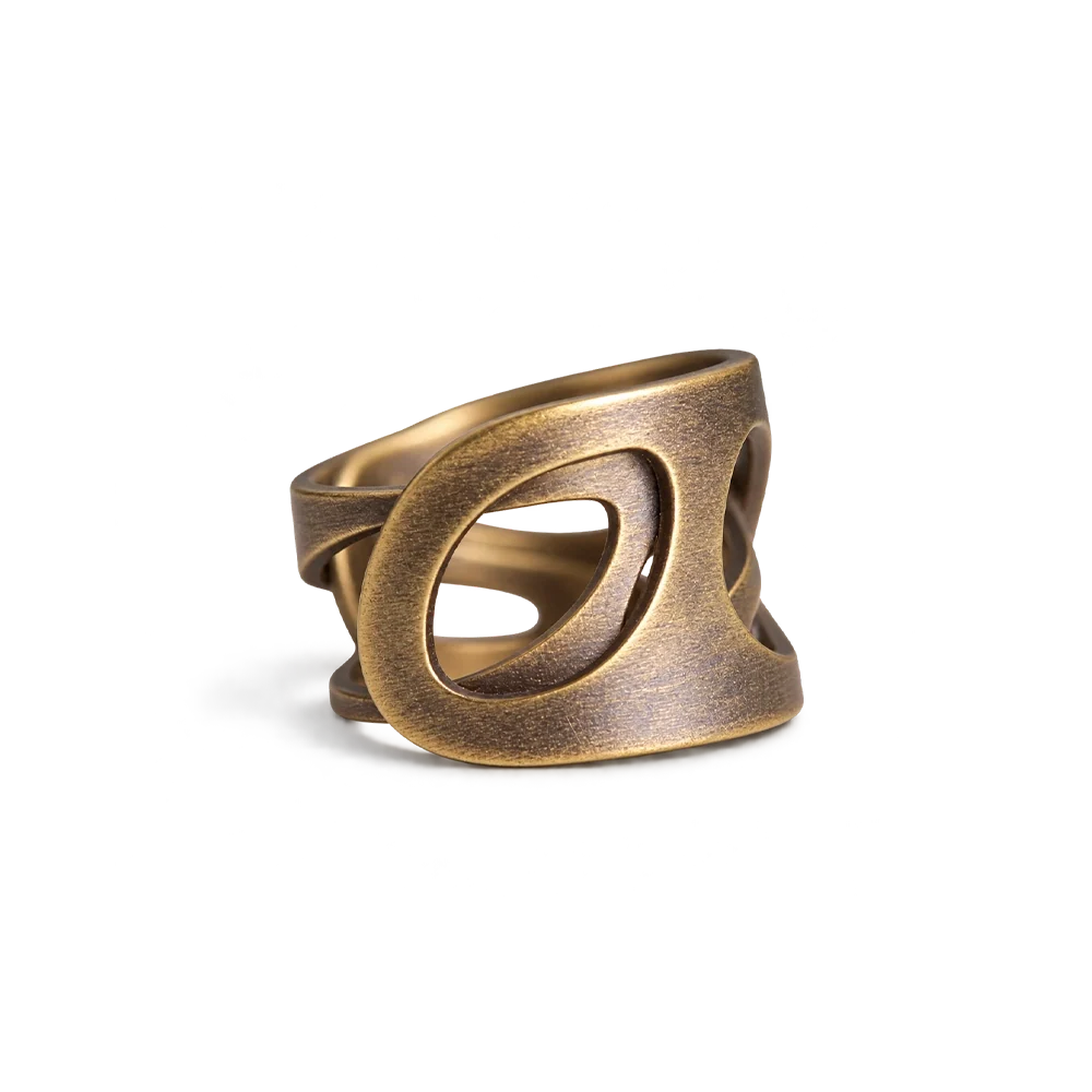 Wide copper ring with crossing oval cutouts and an adjustable open band, white background