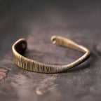Front view of the twisted copper wire cuff showing its open looped ends