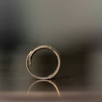Profile of the wire-wrapped copper ring showing its adjustable open shape